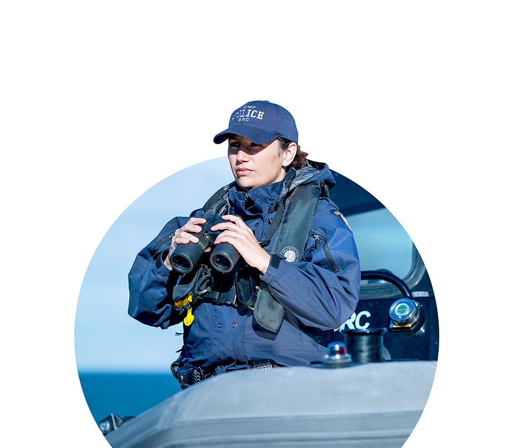 Young woman in uniform holding binoculars